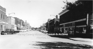 West 6th Street, Newton.  ca. 1957. Looking east.  Frey's Jewelry is located at 133 W. 6th (sign is visible).  HCHM Photo Archives.