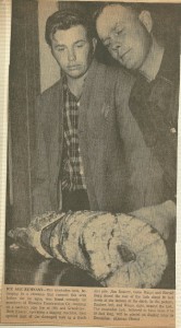 Newton Kansan, 1966. Mastodon Tusk held by Jim Rosiere (lt) and Gene Wingo (rt). HCHM Photo #2012.166.10