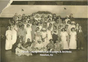 Halloween Party, possibly taken in the auditorium of the Newton City Building, W. 6th, Newton, n.d. Ben McCraw 3rd from right in 2nd standing row.