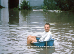 John Buhr floating near D.V. Preheim Farm, 1900 N. Main, Newton, June 1965.